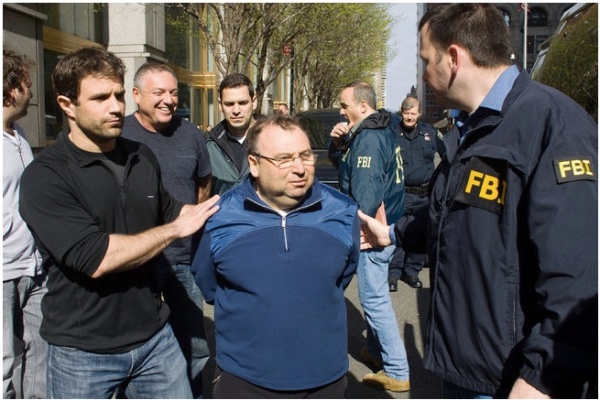 Two men arrested on Tuesday as part of the investigation were Anatoly Shteyngrob and, back, a smiling Anatoly Golubchik.